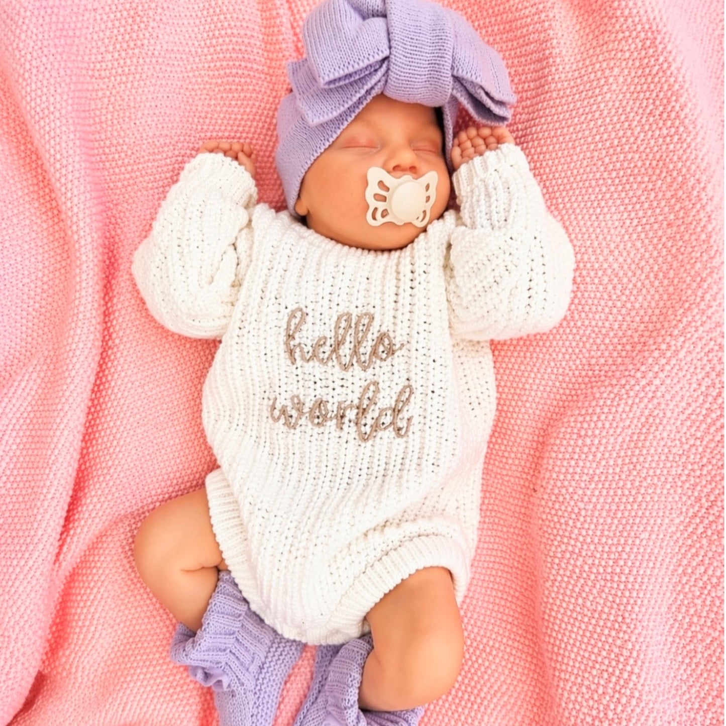hello world knit announcement romper