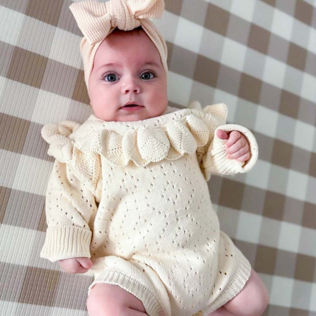 Diamond knit baby girl romper. Baby girl clothing