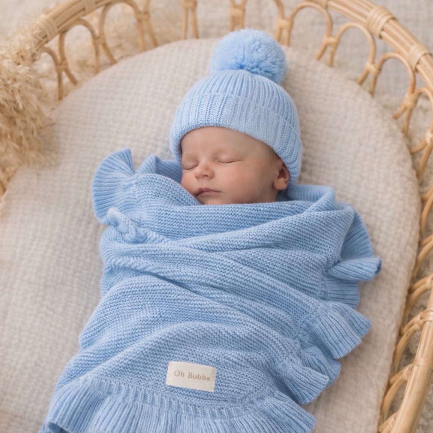 Blue knit newborn baby beanie and knit blanket