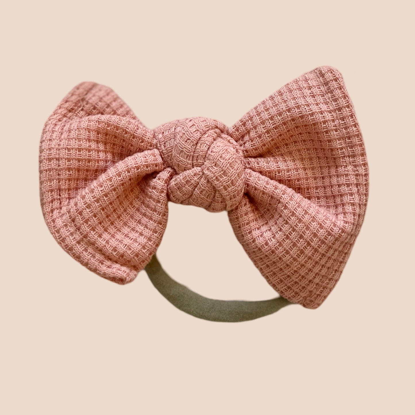 Coral petite waffle baby bow. Newborn baby headband