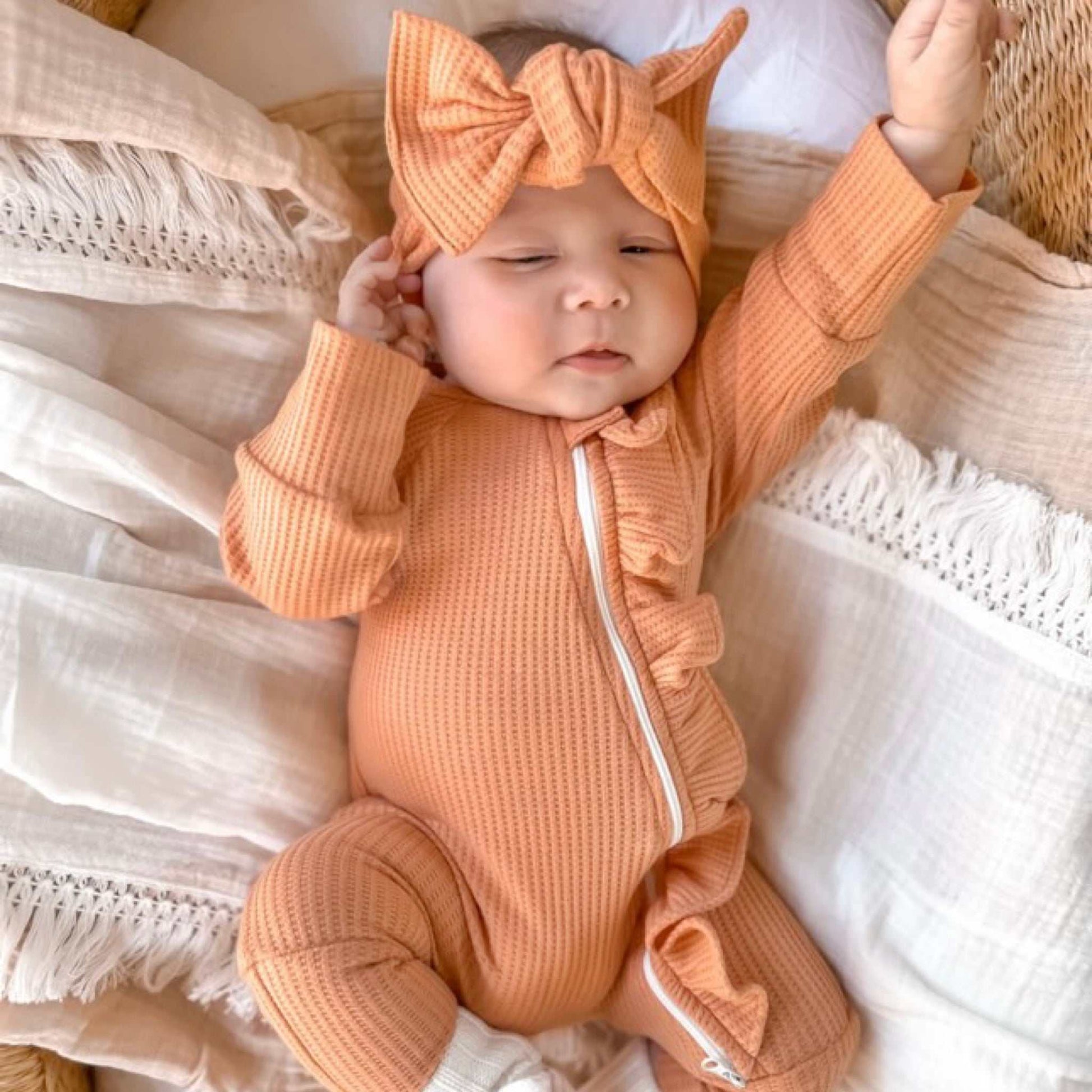 Peach waffle frill onesie. Baby onesie