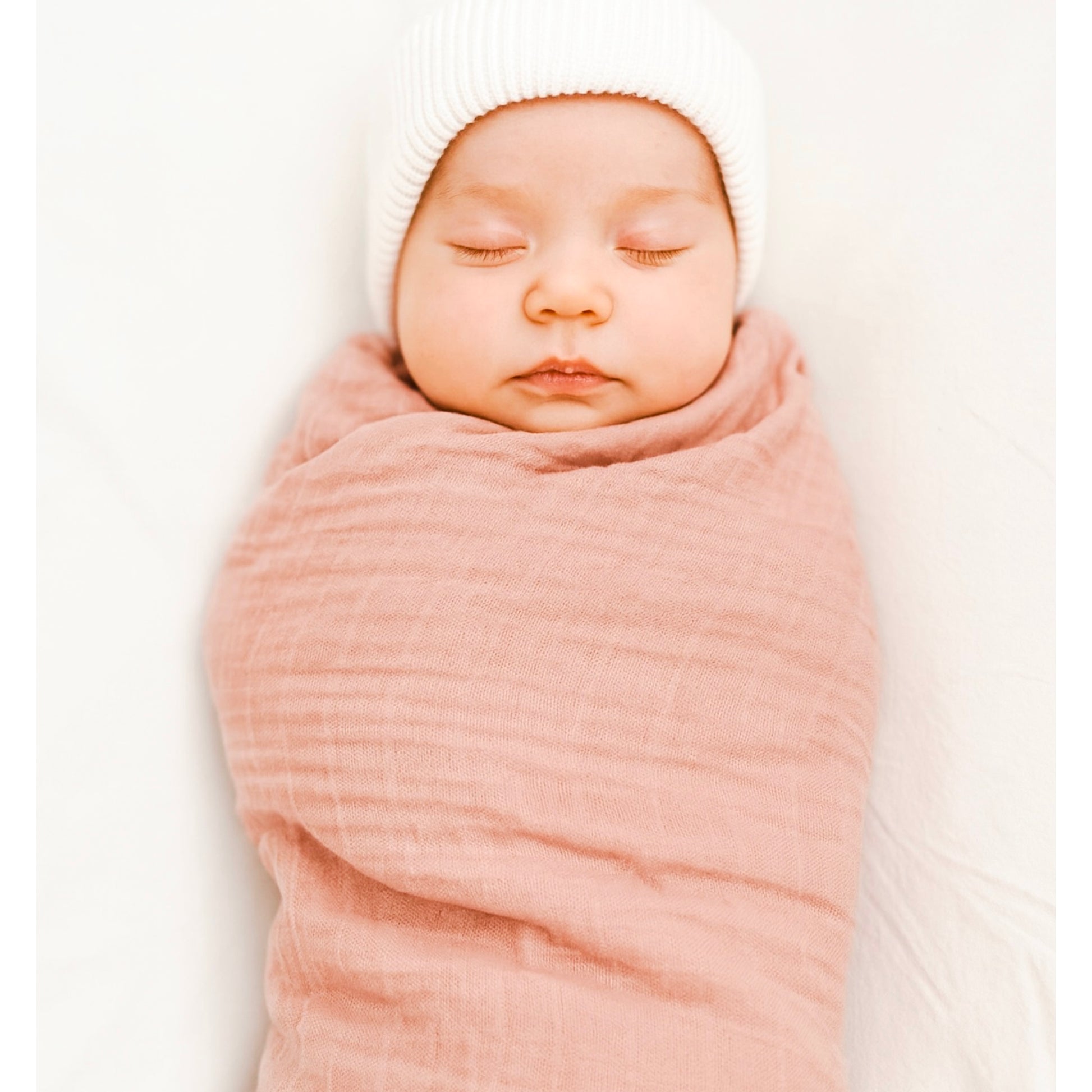Pink newborn muslin wrap.