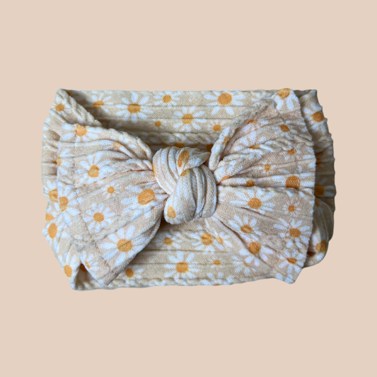 Daisy cable knit baby bow headband. Newborn baby bow
