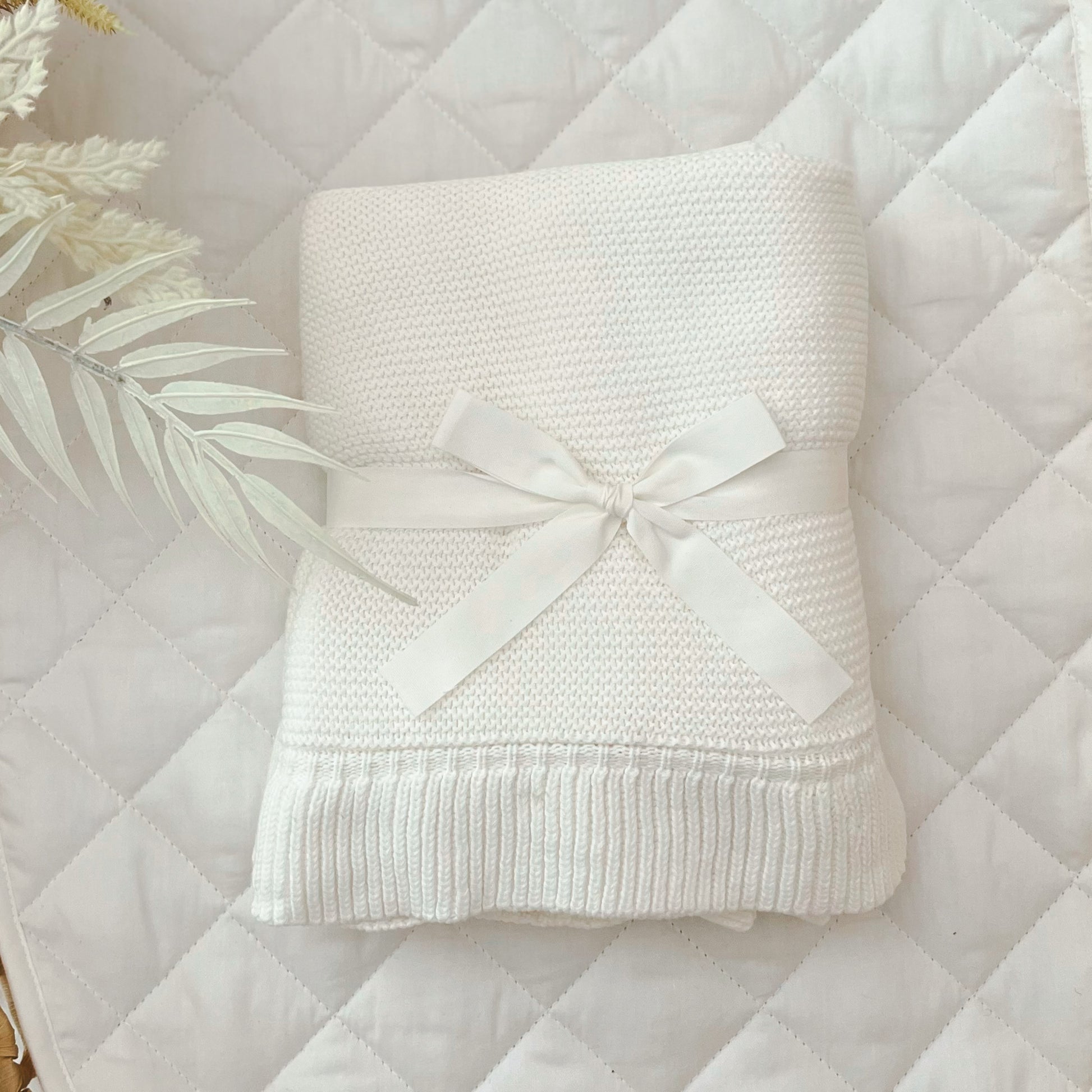 white frill knit baby blanket