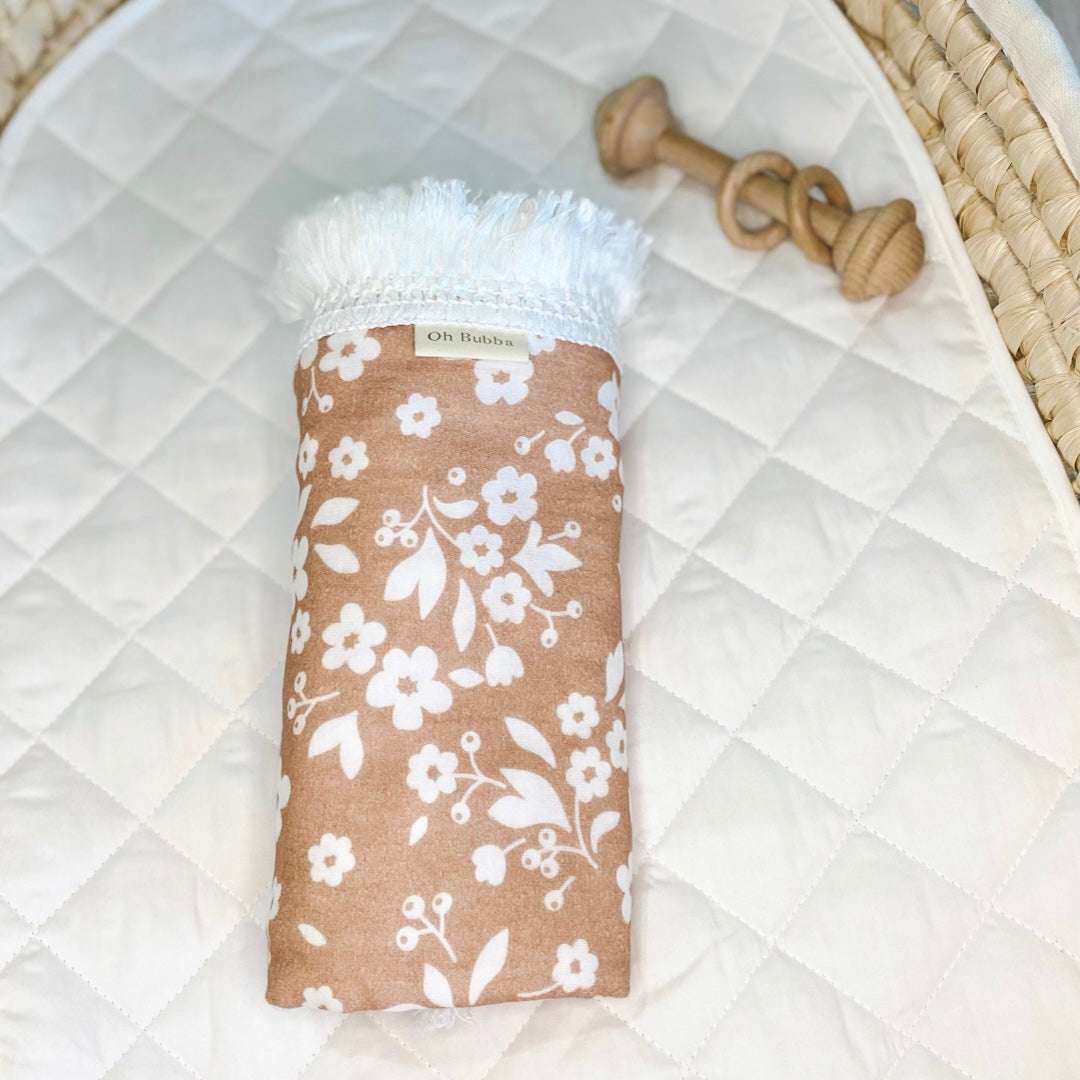 Posies baby fringe swaddle with white fringe. Baby wrap. Baby swaddle. Newborn wrap. Muslin swaddle. Baby blanket. Floral swaddle
