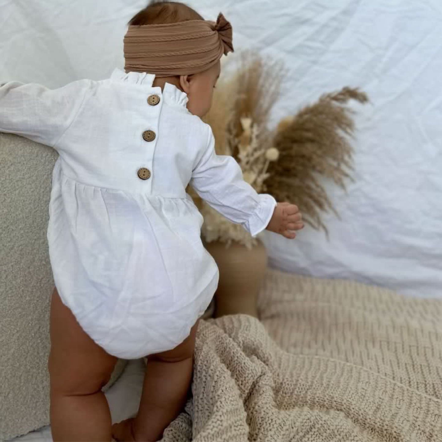 White ruffle baby romper