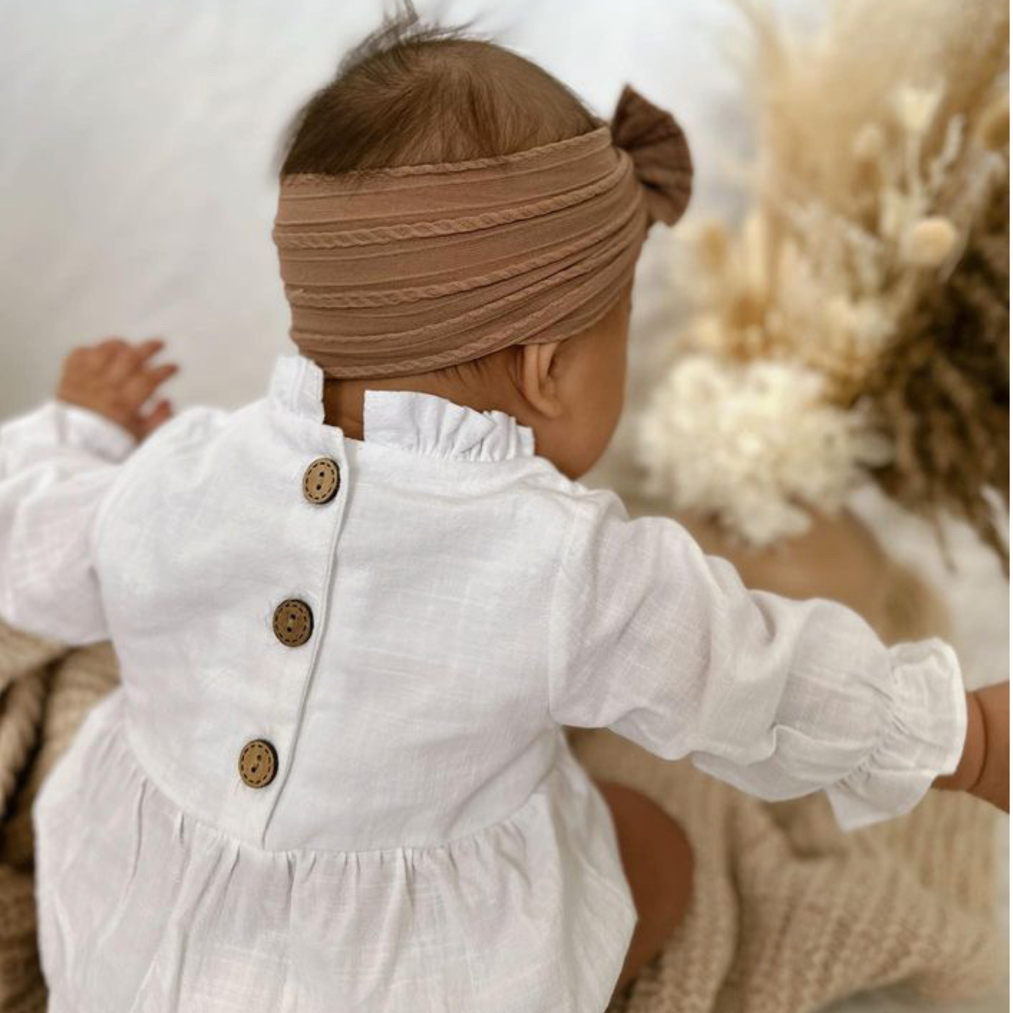 White baby girl romper. Baby girl clothing