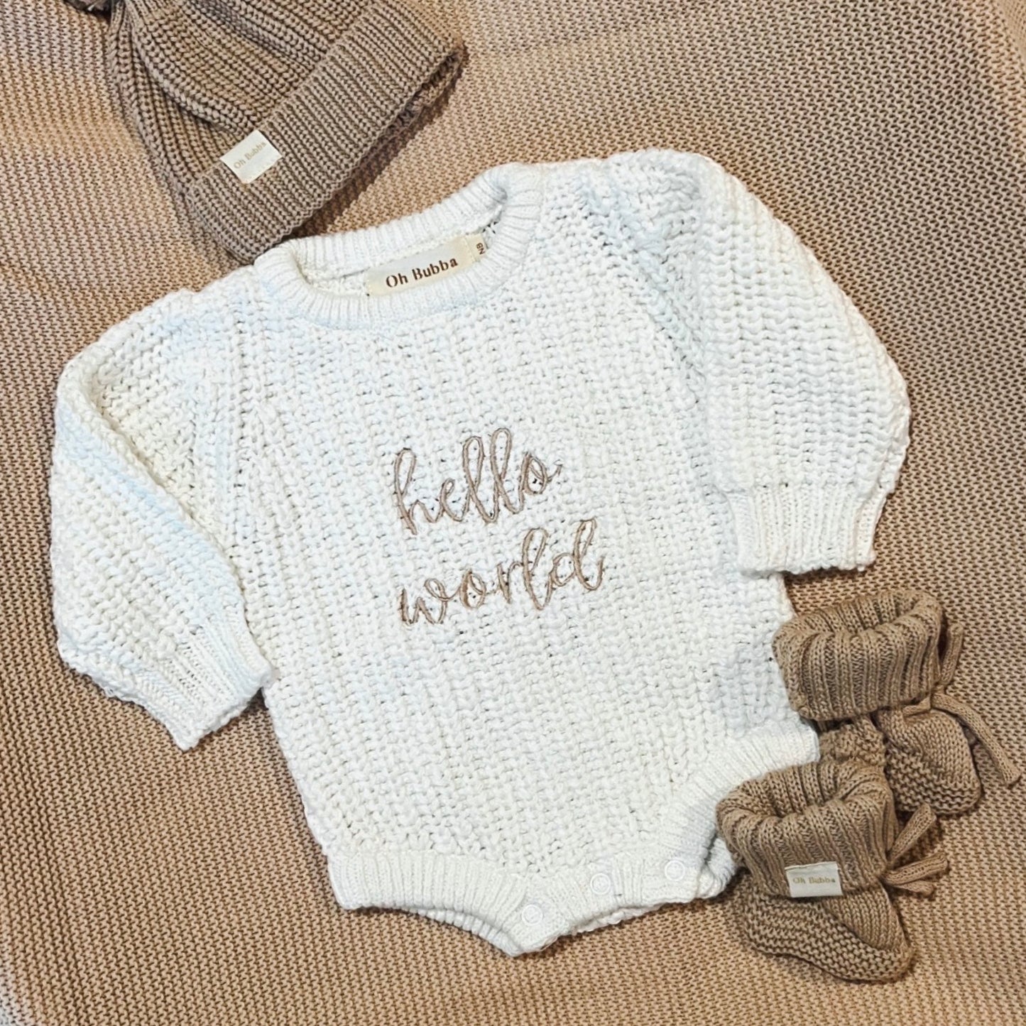 hello world knit announcement romper 
