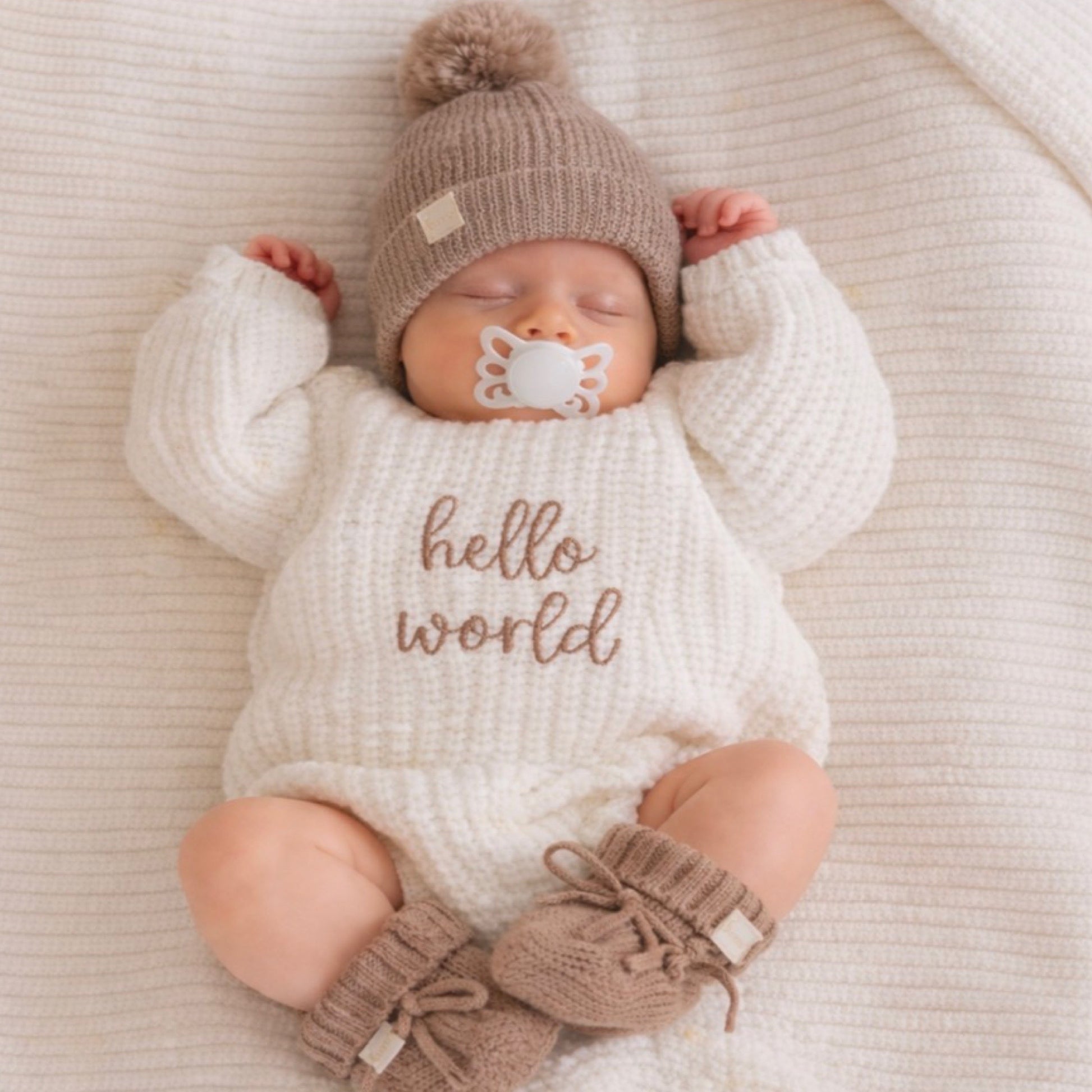 Newborn baby hello world knit announcement romper
