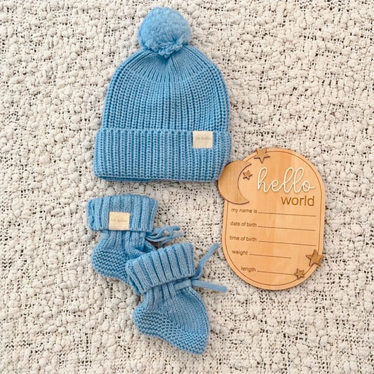 Blue Knit newborn beanie and booties. Hello World announcement disc