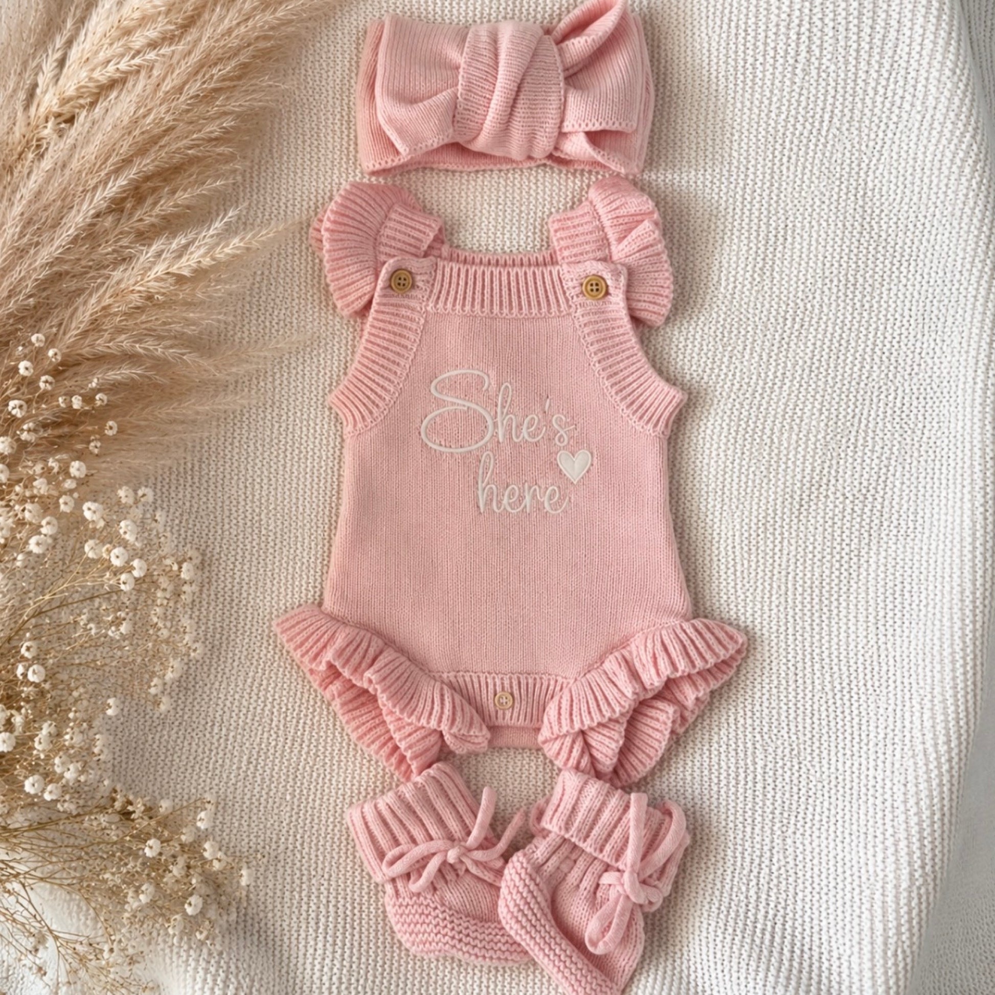 short sleeve pink knit announcement romper. She's here 