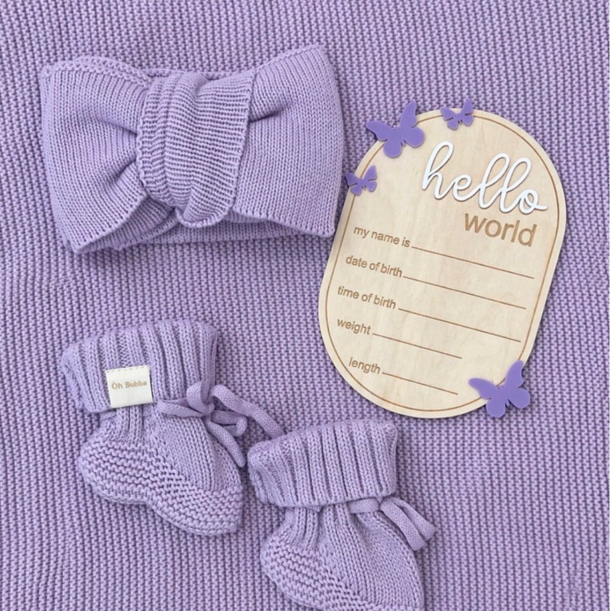 Lilac newborn baby gift. KNit Bow baby booties, hello world butterfly announcement disc