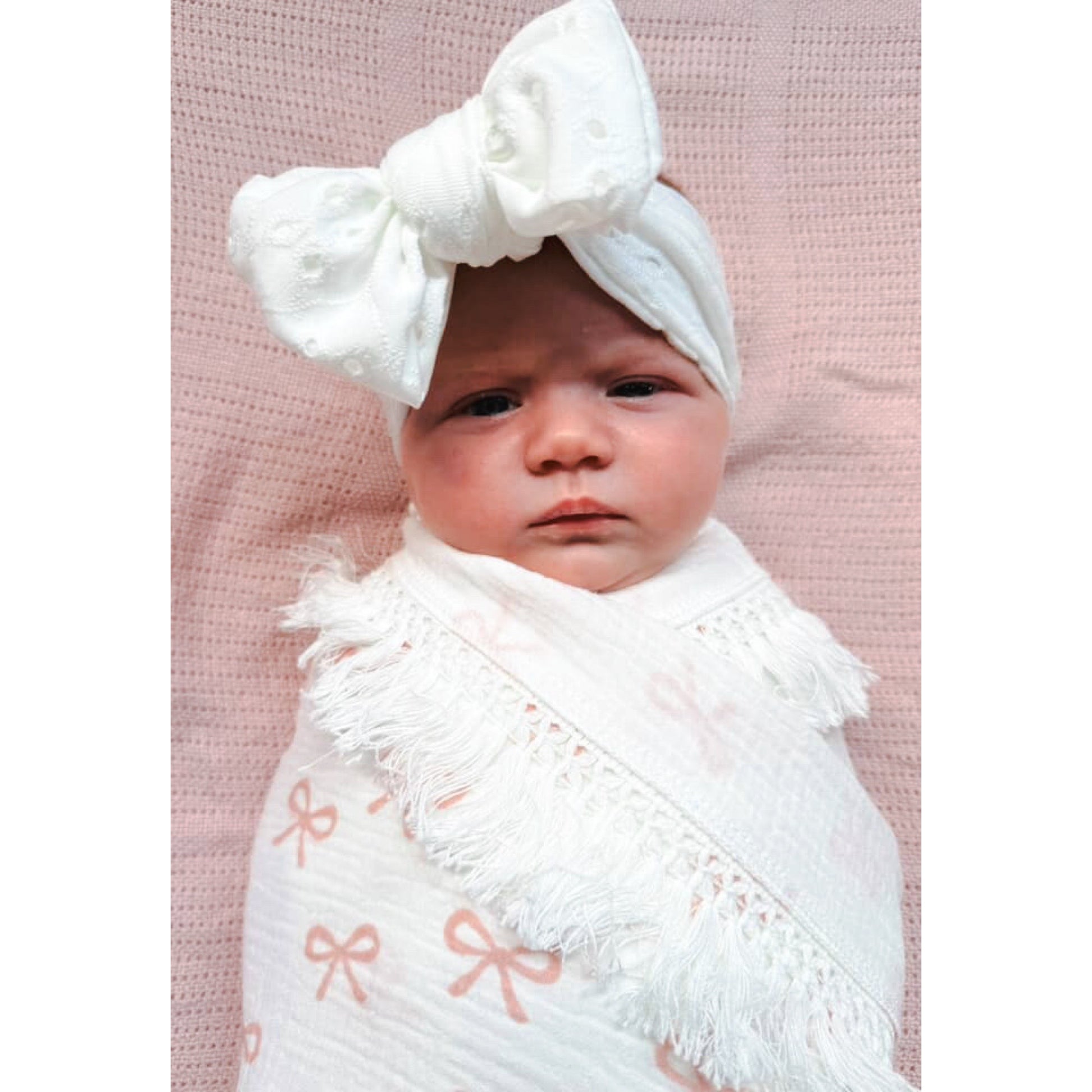 Embroidered white newborn baby bow