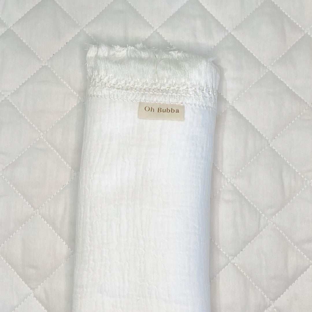 White baby fringe swaddle. Muslin wrap. Newborn baby swaddle